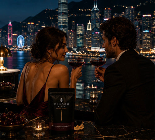 Couple enjoying a romantic moment with drinks and a cityscape in the background