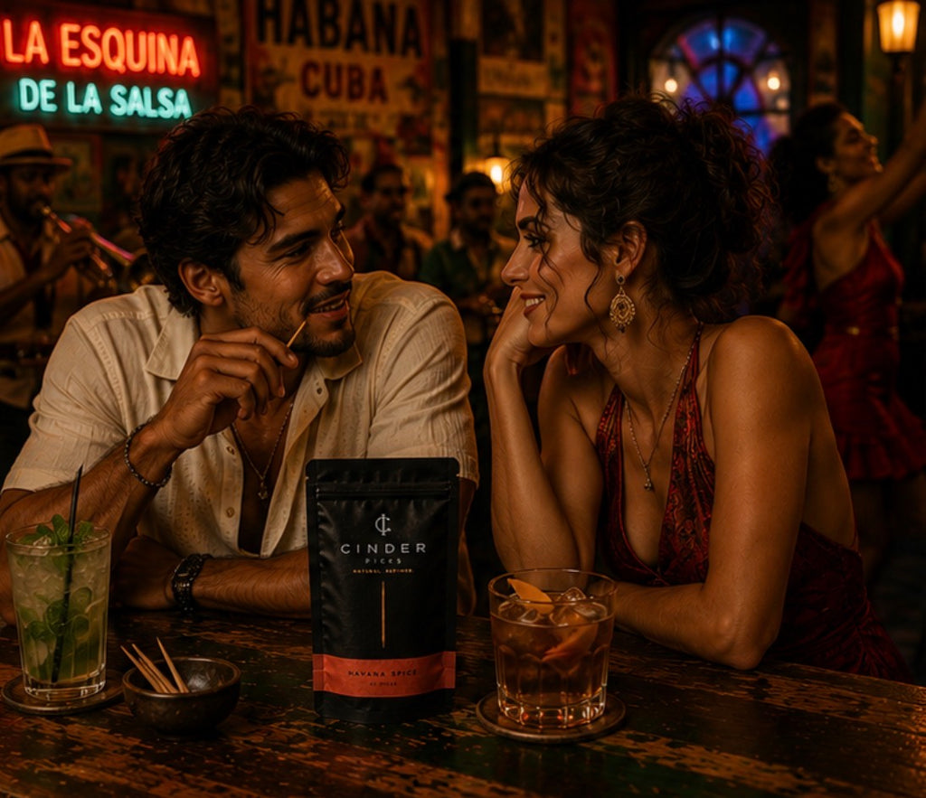 Two people sitting at a bar with a Cinder Picks pouch and drinks, surrounded by neon signs.