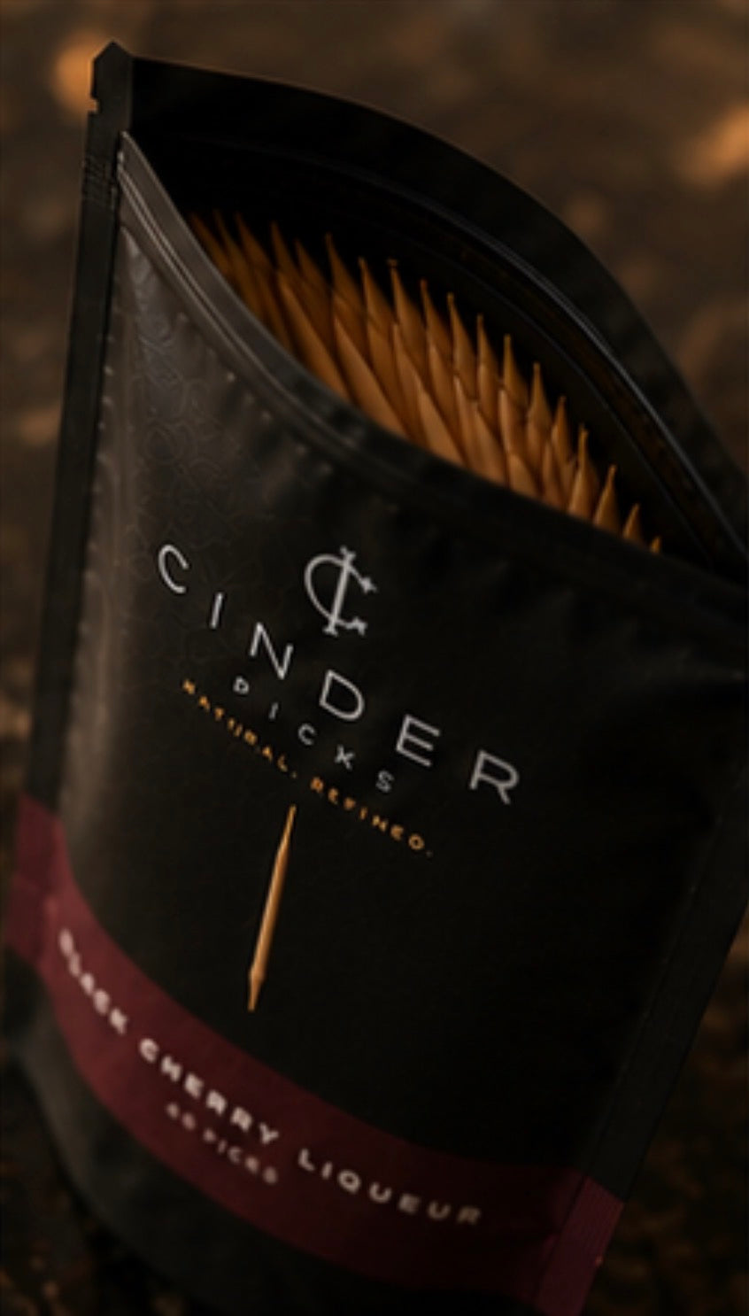 Cinder Picks pouch on a dark background.