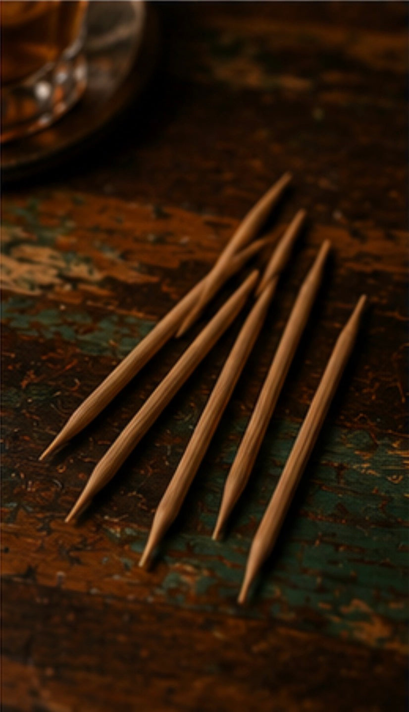 Wooden toothpicks on a textured wooden surface